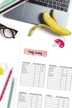 a table with a banana, eyeglasses, pen and paper that says family inventory