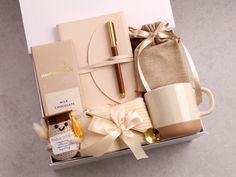 a gift box containing coffee, chocolates and other items for someone's special occasion