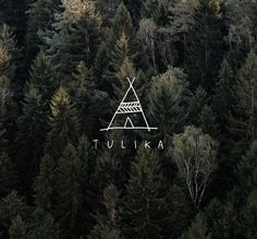 the logo for tulika is surrounded by trees