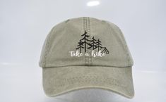 Take a hike Baseball cap Unisex embroidered hat Hiking Climbing Adventure Northwest Hat The PNW Cap Mountain Hat Pacific Northwest Cap 100% Cotton Twill Pigment dyed, garment washed, low profile, six panel Leather strap, antique brass Grommet and Buckle Four rows of stitching on self-fabric sweatband Dyed to match cotton taping Performed bill, sewn eyelets Adams exclusive Cool-Crown mesh in coordinating colors strap closure If you would like to add back or side embroidery of the name or date, pl Mountain Hat, Embroidered Hat, Embroidered Leather, Take A Hike, Crochet Bracelet, Embroidered Hats, Leather Cap, Saturday Sunday, Coordinating Colors