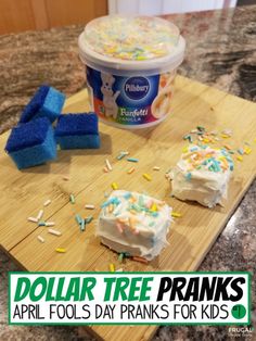 a wooden cutting board topped with cake next to a container of ice cream and sprinkles