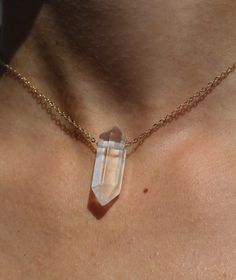 A solitaire double terminated clear quartz crystal is strung on a dainty chain to create the most delicate everyday necklace. Namaste Crystal Babe sources genuine, untreated precious and semi-precious gemstones from all across the globe. Each piece is handmade to order. * m a t e r i a l s * -All-natural, ethically-sourced gemstones -14kt Yellow Gold Fill chain and findings -14kt White Gold Fill chain and findings -925 Sterling Silver chain and findings * t o * o r d e r * -Select desired metal Delicate Pendant Crystal Necklace With Clavicle Chain, Dainty White Crystal Necklace With Delicate Chain, Minimalist Crystal Pendant Necklace With Delicate Chain, Clear Jewelry With Adjustable Chain For Jewelry Making, White Minimalist Round Pendant Crystal Necklace, Minimalist White Round Pendant Crystal Necklace, Everyday Minimalist Crystal Jewelry, Minimalist White Crystal Jewelry, Minimalist Crystal Necklaces With Round Pendant