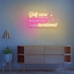 a neon sign that says self care isn't an expensive investment