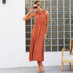 The EMES SHOP dress is detailed with a beautiful tie neck detail. Features solid color. sleeveless. tiered dress. flowy skirt. and ankle length. Pair it with sandals and sunnies for a fabulous look.MATERIAL:100% Viscose MEASUREMENTS:Dress Length is 55-57in Small | Bust: 35-37in & Waist: 24-26in Medium | Bust: 37-39in & Waist: 26-28in Large | Bust: 39-41in & Waist: 28-30in X Large | Bust: 41-43in & Waist: 30-32in MEASUREMENTS:Dress Length is 140-145cm Small | Bust: 88-93cm& Waist: 60-65cm Medium Solid Color Tiered Midi Dress For Summer, Solid Tiered Midi Dress For Beach, Tiered Solid Color Maxi Dress For Summer, Solid Color Tiered Maxi Dress For Summer, Solid Tiered Summer Maxi Dress, Solid Color Tiered Maxi Dress For Vacation, Casual Tiered Skirt Maxi Dress For Summer, Tiered Maxi Dress For Vacation, Brown Tiered Midi Dress For Summer