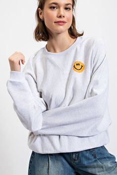 Stay cozy and keep it cute in the Evie Smiley Sweatshirt! With its playful graphic of a smiley faces, this sweat won't just keep you warm, it'll keep you smilin' too! Yayyyy!!! Playful Relaxed Fit Winter Tops, Playful Relaxed Fit Tops For Winter, Relaxed Fit Smiley Face Top For Loungewear, Smiley Face Top For Loungewear, Trendy Smiley Face Tops For Loungewear, Trendy Smiley Face Loungewear Tops, Casual Winter Tops With Smiley Face, Playful Sweatshirt With Ribbed Cuffs For Loungewear, Playful Oversized Crew Neck Sweatshirt