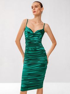 Linger in the luxury of this emerald ruched midi dress, designed to make a bold statement with its rich hue and sumptuous texture. The delicate spaghetti straps frame a sleek silhouette, leading to a gently ruched bodice that flatters and enhances your natural curves. The skirt, ruched to perfection, creates a silhouette that is both alluring and sophisticated, making it ideal for upscale events or romantic evenings out. This dress is an epitome of elegance, offering a modern twist on classic velvet grandeur. Size US Bust Hip Size Length Waist Size S 4 30.7 31.5 38.4 25.6 M 6 32.3 33.1 40 27.2 L 8/10 33.9 34.6 40.6 28.7 Elegant Green Ruched Midi Dress, Elegant Green Midi Dress With Ruched Bodice, Green Ruched Bodice Midi Dress For Evening, Green Midi Dress With Ruched Bodice For Evening, Formal Green Ruched Midi Dress, Green Ruched Midi Dress For Party, Green Ruched Midi Dress For Cocktail, Evening Midi Dress With Spaghetti Straps And Ruched Details, Green Dress With Spaghetti Straps And Ruched Back