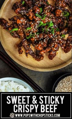 sweet and sticky crispy beef served on a wooden plate with chopsticks