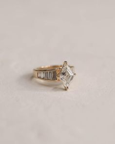 an engagement ring with a baguette cut diamond