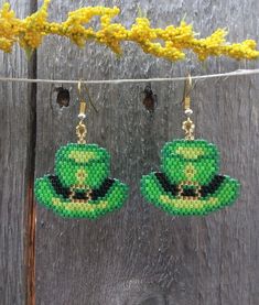 St. Patrick's Day Beaded Hat earrings, so fun to wear around St. Patrick's Day or any day if your Irish. Earrings are made with high quality Delica beads in greens, black and gold with a gold ear wire. Add a little luck of the Irish to your wardrobe and go in style! Fun and light weight to wear! 100% Handmade with my passion for beading and attention to detail. Each piece can take hours to complete one bead at a time. Length of the earrings - 1 inch by 1 inch beading without ear hook and 2 inches with ear hook Please check out the many other listings in my shop! https://barbsbeadingstudio.etsy.com Original design by Sandra Caufield at ForbesFarmGifts Handmade in the heart of Oklahoma, USA I've made every effort to get accurate photos so you can see all the details. If you still have any qu Green Round Beads Novelty Jewelry, Green Novelty Jewelry With Round Beads, Adjustable Beaded Earrings With Bead Caps As Gift, Adjustable Green Hats As Gifts, Adjustable Green Hat For Gift, Adjustable Green Hat As Gift, Adjustable Green Hat As A Gift, Green Novelty Hat As Gift, Green Novelty Hat As A Gift