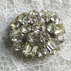 This is a sparkling brooch produced by the designer WEISS and signed. It has no discolored or bad stones.  It was made in the 60's and all stones are set in silver colored metal.  It measures 1.5" and is signed, and in excellent condition. Vintage Sparkling Brooches For Party, Vintage Crystal Brooches For Formal Occasions, Vintage Rhinestone Brooches For Anniversary, Vintage Sparkling Brooches For Formal Wear, Vintage Sparkling Brooch For Formal Occasions, Vintage Brooches With Sparkling Stones As Gift, Vintage Brooches With Sparkling Stones For Gift, Vintage Sparkling Brooches For Formal Occasions, Vintage Crystal Brooches For Anniversary