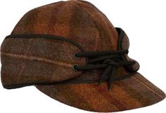 The Wyoming Traders Mackenzie Wool Hat is breathable and naturally water resistant. Made from Australian wool with quilted satin lining and pull down ear flaps, this hat offers unmatched comfort. Great for any outdoor activities. 20 oz. Australian Wool Naturally Water Resistant Breathable 4 Panel Crown Construction Cap Brim Quilted Satin Lining Pull Down Ear Flaps with Fleece Lining Multiple Sizes and Colors Dry Clean Only Colors: Black, Charcoal, Navy, Red Plaid, Slate, Tan Plaid Sizes: 6 7/8, Winter Outdoor Brimmed Baseball Cap, Windproof Cap For Fall, Windproof Brimmed Hats For Fall, Classic Windproof Hat For Outdoor, Windproof Curved Brim Hat For Outdoor, Winter Outdoor Baseball Cap, Casual Windproof Hats For Fall, Brown Fall Baseball Cap For Outdoor, Fall Hats With Curved Brim For Outdoor Activities