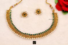 *Light Weight Gold Adjustable necklace set with earrings and tikka. *Studded with crystal stone. *No.1- green *Earrings Length- 2.5 inches(included pearl drop) *Breadth- 1.9 inches *No.2- Ruby *Earrings Length- 1.8 inches(included drop) *Stud diameter- 0.6 inches *No.3- Gold *Earrings Length- 1.6 inches(included pearl drop) *No.4- Gold *Earrings Length- 1.4 inches(included pearl drop) *No.5- Gold *Earrings Length- 1.1 inches(included pearl drop) Green Round Kundan Necklace In Temple Jewelry Style, Green Round Temple Necklace For Wedding, Green Jewelry Sets With Stone Work, Green Round Temple Jewelry Bridal Necklace, Bollywood Green Round Jewelry Sets, Bollywood Style Green Jeweled Bridal Necklace, Green Temple Jewelry Sets, Jeweled, Green Jeweled Temple Jewelry Sets, Necklace Set With Earrings