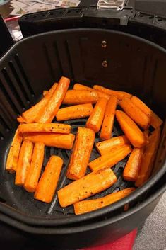 cooked carrots in an air fryer basket