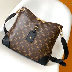 Louis Vuitton launched the new Odeon medium handbag in the autumn and winter of 2020, which conveys a retro flavor with Monogram canvas and reinforced leather corners. The adjustable shoulder strap makes it easy to carry on the shoulder or crossbody, and you can easily access the accompanying items by simply opening the zipper.

Size: 31.0 x 27.0 x 9.0 cm (LxHxW)
• Monogram coated canvas
• Semi-aged calfskin trim
• Textile lining
• metallic parts
• Leather corners
• Double zip closure
• High-end Large Capacity Coated Canvas Shoulder Bag, Monogram Canvas Satchel Shoulder Bag With Removable Pouch, Designer Bags In Signature Coated Canvas For Daily Use, Designer Daily Use Bag In Signature Coated Canvas, Light Luxury Monogram Canvas Bag For Daily Use, Daily Use Light Luxury Monogram Canvas Bag, Monogram Canvas Shoulder Bag For Everyday Use, Monogram Canvas Satchel With Removable Pouch For Errands, Everyday Monogram Shoulder Bag