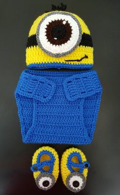 a crocheted minion hat and slippers are on display