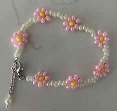 Hand Beaded dainty unique white/pink coloration glass bead bracelet.  Great gift to give or for yourself!  Fun to wear or give!  Perfect for daughter or granddaughter!  Adjustable length up to 7.5" Each bracelets is unique & individually handcrafted. Pink Friendship Bracelets With 8mm Round Beads, Handmade White Pearl Flower Bracelet, Handmade White Flower Pearl Bracelet, Handmade White Pearl Bracelet With Flower Shape, Cute White Pearl Bracelet For Gift, Cute Beaded Pearl Bracelet Gift, Cute Beaded Pearl Bracelet As Gift, Cute Beaded Pearl Bracelet As A Gift, Dainty Pink Beaded Pearl Bracelet