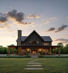 a house that is in the grass with steps leading up to it's front door