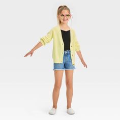 These Mid-Rise Cut-Off Jean Shorts from Cat & Jack™ feature frayed detailing on the hem to add a cool touch of laid-back style to your child's wardrobe. Made from stretchy denim fabric, these regular-fit shorts offer easy movement and all-day comfy wear. Plus, the belt loops and a front fly snap and zipper closure provide a secure, adjustable fit. They can pair them with a variety of different tops for tons of stylish warm-weather looks. Cat & Jack™: Kids’ clothing with an imagination of its own Mid Rise Jean Shorts, Comfy Wear, Cut Off Jeans, Laid Back Style, Denim Fabric, Girls Shopping, Kids Clothing, Workout Shorts, Cut Off