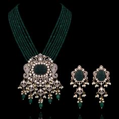 A pure masterpiece of glitz, grace, and elegance - perfect to enhance your festive attire! Make a statement and ethereal impression with an alluring ensemble embellished with CZ and carved stones, vintage bead work, pearl moti detailing and elephant motifs adding a festive charm to uplift your look. The set includes a mala and a pair of matching earrings. Approximate mala length is 12" & earrings length is 3.5". Gold-plated on high-quality brass as base metal. Aarti Set (White) is in-stock & rea Traditional Kundan Hand Embellished Sets, Traditional Kundan Hand-embellished Sets, Elegant Festive Chandbali Traditional Wear, Elegant Sets With Intricate Design For Reception, Elegant Kundan Traditional Wear For Diwali, Intricate Design Sets For Diwali Reception, Intricate Design Sets For Reception At Diwali, Elegant Traditional Wear With Meenakari For Parties, Diwali Kundan Hand Embellished Anarkali Set