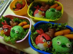 three plastic containers filled with angry birds and vegetables