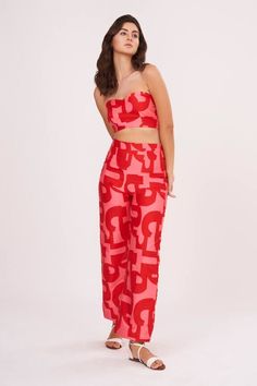 Red cotton satin tube top with abstract print. Comes with palazzo.
Components: 2
Pattern: Printed
Type Of Work: Abstract
Neckline: Tube Neck
Sleeve Type: Sleeveless
Fabric: Cotton Satin
Color: Red
Other Details: 
Attached lining
Closure : Top - Back hooks
Occasion: Party,Resort - Aza Fashions Chic Bold Print Summer Pants, Chic Printed Wide Leg Sets, Red Wide Leg Summer Sets, Red Wide Leg Sets For Summer, Red Wide Leg Sets For Spring, Chic Red Sets For Night Out, Red Sets For Spring Night Out, Red Sets For Night Out In Spring, Chic Red Sets For Spring