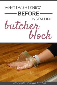 a woman's hand is wrapped in plastic on top of a wooden table with the words, what i wish i knew before installing butcher block