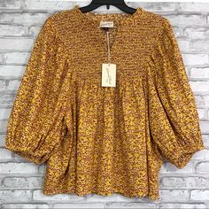 New To Poshmark? Use Code Happyoutfit To Save $10 On Your First Purchase! Universal Thread Women’s Yellow Floral Print Smocked Peasant Blouse. Puffy Wide 3/4 Sleeves, Elastic Cuffs And Ruffled Collar With V Notch Neckline. - Size S: Pit To Pit 20" - Length 24" - Size M: Pit To Pit 21" - Length 25" - Size Xl: Pit To Pit 23” - Length: 25.5” - Size Xxl: Pit To Pit 24" - Length: 26" Condition: New With Tags Ruffle Shirts Blouses, High Neck Shirts, Tie Sleeve Blouse, Red Knit Sweater, Women Floral Blouse, Floral Pullover, Sleeveless Tops Summer, Balloon Sleeve Blouse, Gingham Tops