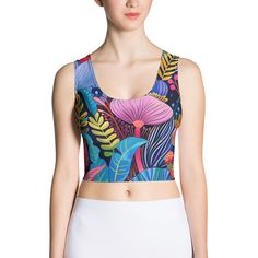 Look fabulous in an all-over printed, body-hugging crop top, now offering FREE SHIPPING to the US, Canada, EU, and UK! The artwork This artwork is a vivid and richly detailed depiction of a variety of African flowers, showcasing a tapestry of vibrant colors and intricate patterns. The piece features a dynamic assortment of floral elements, including large, bold blossoms and delicate foliage, all set against a deep blue background. The use of contrasting colors and stylized forms captures the lus Workspace Essentials, French Collection, African Flowers, Cropped Tops, Spring Collection, Blue Backgrounds, Laptop Sleeves, Crop Tops Women, Contrasting Colors