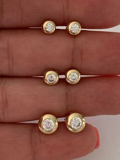 14K Yellow Gold Bezel Stud Earrings | Solitaire Earrings | Cubic Zirconia Studs | Dainty Bezel Studs | 5MM, 6MM, 7MM Shiny Everyday Earrings | Bezel Set Diamond Alike Earrings Studs | 14k Gold Earrings | 14K Gold Bezel Studs♦ Materials: 14K Gold♦ Available colors: Yellow Gold ♦ Closure: Push Back♦ Earrings Measurements: 5 MM, 6MM and 8MM. PLEASE REFER TO THE ACTUAL DIMENSIONS. WE HAVE ENLARGED THE PICTURES FOR A BETTER VIEW-------------------------------------------------- ♦ -------------------- Blink Blink, Solitaire Earrings, Gold Ring Designs, Tragus Earrings, Gold Bracelet For Women, Marvel Entertainment, Classic Earrings, Beaded Collar, Stud Jewelry