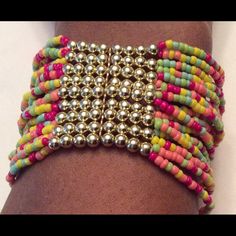 Multicolor And Gold Beaded Bracelet Adjustable Multicolor Jewelry With Gold Beads, Multicolor Multi-strand Bracelets, Multicolor Beads For Summer Parties, Multicolor Friendship Bracelets With Gold Beads For Beach, Multicolor Gold Beads Friendship Bracelet For Beach, Festival Bracelets With Colorful Metal Beads, Multicolor Metal Beaded Bracelets, Festival Multicolor Metal Beaded Bracelets, Colorful Spacer Beads For Bracelets