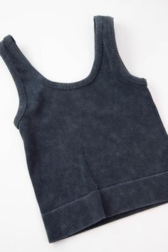 Add some edge to your wardrobe with our Natalia Mineral Wash Tank Top in Black. The unique mineral wash gives each top a one-of-a-kind look. Featuring a seamless design, this top ensures maximum comfort and versatility. Get ready to stand out in style! General Info: 93% Nylon, 7% Spandex Hand Wash Cold; Line Dry Mineral Wash Seamless Fit Guide: Shape & Fit: Fitted Fabric Elasticity: Minimal to Moderate Stretch Fabric Texture: Ribbed Model 1: Height: 5’10” | Bust: 32" | Waist: 24" | Hip: 34” | Si Trendy Acid Wash Tops For Loungewear, Acid Wash Soft-washed Tops For Loungewear, Cotton Seamless Tops For Loungewear, Relaxed Fit Seamless Cotton Tops, Cotton Seamless Relaxed Fit Tops, Seamless Cotton Tops With Relaxed Fit, Everyday Cotton Stonewashed Tops, Cotton Stonewashed Tops For Everyday, Everyday Stonewashed Cotton Tops