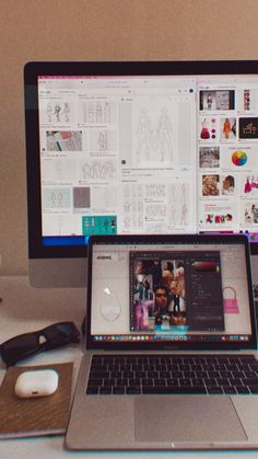 an open laptop computer sitting on top of a desk next to a mouse and keyboard