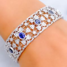 Impressive Floral Blue Sapphire Diamond + 18k Gold Bracelet Blue Diamond Platinum Bracelet For Formal Occasions, Formal Blue Diamond Platinum Bracelet, Blue Diamond Bracelet For Wedding, Hand Set Blue Diamond Bracelet, Wedding Sapphire Bracelet With Brilliant Cut Diamond, Brilliant Cut Sapphire Bracelet For Wedding, Blue Diamond Bracelet For Wedding With Accents, Wedding Sapphire Bracelet With Brilliant Cut, Blue Brilliant Cut Diamond Bracelet For Wedding