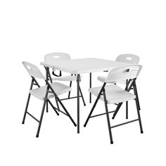 four white folding chairs sitting next to each other on top of a white table and chair