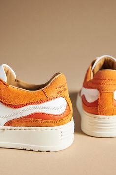 These retro-inspired low-top sneakers by ALOHAS pop with zigzag stitching, suede overlay details, and elevated soles for undisputed comfort and style. | Low-Top Sneakers by ALOHAS in Orange, Women's, Size: 38, Leather/Rubber/Suede at Anthropologie Orange Sneakers Women, Retro Sneakers With Textured Sole And Round Toe, White Casual Sneakers With Contrast Stitching, Casual White Sneakers With Contrast Stitching, Trendy Suede Sneakers With Vulcanized Sole, Retro High-top Sneakers With Textured Sole, Low-top Sneakers With Contrast Stitching For Streetwear, Leather Sneakers With Contrast Stitching And Round Toe, Lace-up Sneakers With Contrast Stitching For Streetwear