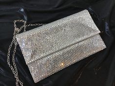 Gorgeous timeless evening bag with removable chain. Size: 9.5" * 0.5" * 5.5" Item Number: 459-6 Item ID: 22199 Category: Purse Silver Evening Bag With Chain, Silver Chain Evening Clutch, Chain Clutch Evening Bag, Chain Clutch For Night Out, Chain Clutch Evening Bag For Night Out, Clutch With Chain For Night Out, Formal Evening Clutch With Chain, Glamorous Evening Clutch With Chain, Item Number