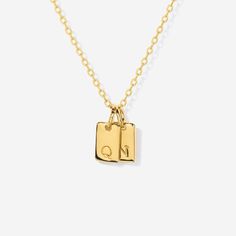 Embrace timeless elegance with this chic initial tag charm, a versatile piece designed to add a personal touch to any ensemble. Featuring a sleek, rectangular silhouette with a subtly embossed initial, this charm crafted from lustrous material is perfect for personalizing your favorite chain, bracelet, or accessory. Ideal for layering or as a standalone statement, this charm is a stylish way to keep a special initial close to your heart. Charm size: 10 mm x 5 mm Made of 14K gold over sterling si Minimalist Engraved Initial Necklace With Rectangular Pendant, Engraved Initial Necklace With Square Pendant, Everyday Engraved Initial Necklace With Square Pendant, Everyday Engraved Square Pendant Initial Necklace, Engraved Square Pendant Initial Necklace For Everyday, Personalized Classic Initial Necklace With Rectangular Pendant, Classic Personalized Initial Necklace With Rectangular Pendant, Everyday Elegant Nameplate Charm Necklaces, Elegant Everyday Nameplate Charm Necklaces