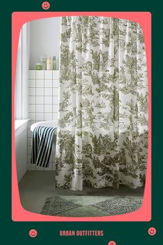 a bathroom with a green and white shower curtain