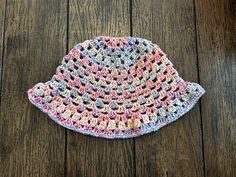 The cutest little bucket hat for spring and summer! Made with acrylic yarn (Big Twist Party). Fits an average sized head. Cute Adjustable Bucket Hat For Spring, Handmade Pink Sun Hat For Spring, Fun Multicolor Bucket Hat For Spring, Multicolor Bucket Hat For Spring, Playful Multicolor Sun Hat For Spring, Cute Brimmed Crochet Beach Hat, Fun Bucket Hat For Spring, One Size Yarn Sun Hat For Spring, One Size Summer Bucket Hat Made Of Yarn