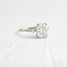 an engagement ring with a cushion cut diamond