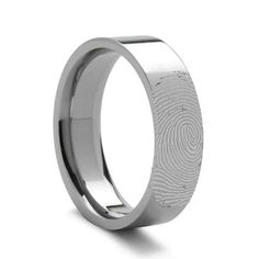 a wedding ring with a fingerprint in the middle and an engraved design on it