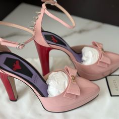 This Is An Authentic Pair Of Gucci Patent Double G Bow Sadie Spike Platform Pump Size 40 In Perfecct Pink. These Stylish Pumps Are Crafted Of Patent Leather In Light Pink With A Red Heel. They Feature A Pointed Toe And A 4.75-Inch Heel And A 1-Inch Platform. Comes With Fashionphile Certificate Of Authenticity, Box And 2 Dust Bags. Gucci Pointed Toe Heels With Red Sole, Gucci Heels With Sculpted Heel For Spring, Gucci Spring Heels With Sculpted Heel, Pink Ankle Strap Feminine Heels, Feminine Pink Ankle Strap Heels, Pink Patent Leather Heels With Sculpted Heel, Pink Feminine Heels With Heel Strap, Feminine Pink Heels With Heel Strap, Pink Feminine Ankle Strap Heels