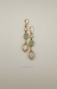 I have combined with a Burmese Jade, natural pink pearls, pink tourmaline and a large Amethyst to make a pair of statement earrings A simple yet elegant design that can enhance your daily look instantly. 14k gold filled ear wires,  Earring drop approx. 7 cm Every piece uses natural stones that will vary slightly in colour and inclusions, making every piece truly unique. Jade calms the nervous system and channels passion in constructive ways. It is said to attract good luck and friendship. These Elegant Gemstone Beads Dangle Earrings, Elegant Dangle Earrings With Gemstone Beads, Elegant Gemstone Beads Earrings For Gift, Pink Natural Stones Wedding Earrings, Elegant Wedding Earrings With Gemstone Beads, Wedding Pink Earrings With Natural Stones, Burmese Jade, Pink Pearls, Jade Earrings