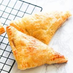 three pastries sitting on top of a cooling rack