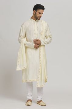 Cream kurta with thread embroidered floral patterns and sequin work embellishments. Comes with churidar and dupatta. - Aza Fashions Chanderi Sherwani With Zari Work For Festivals, Festival Sherwani With Zari Work In Chanderi, Traditional Slub Silk Kurta With Dabka Work, Unstitched Kurta In Raw Silk With Traditional Drape, Semi-stitched Chanderi Sherwani With Cutdana, Transitional Raw Silk Kurta With Dupatta, Eid Traditional Wear With Zari Work On Dola Silk, Slub Silk Kurta With Zari Work In Traditional Drape, Festive Slub Silk Kurta With Traditional Drape