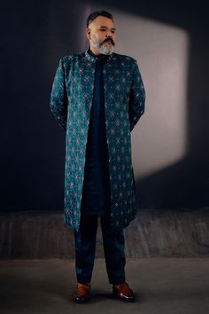 Teal green floral jamawar embroidered front open sherwani with dabka highlighting. Paired with matching angrakha kurta and tapered trousers.
Component: 3
Pattern: Embroidered
Type Of Work: Floral
Neckline: Open
Sleeve Type: Long
Fabric: Linen Silk
Color: Green
Other Details: 
Floral embroidery
Occasion: Groom,Wedding - Aza Fashions Open Sherwani, Jatin Malik, Angrakha Kurta, Embroidered Sherwani, Luxury Footwear, Open Sleeve, Tapered Trousers, Sherwani, Custom Tailoring