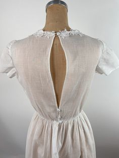 Fitted Lace Back Dress For Confirmation, Confirmation Dresses With Lace Back, Summer Maxi Dress With Lace Trim For Wedding Night, Elegant Cotton Dress With Delicate Lace, Lace Dresses With Smocked Back For Daywear, Cotton Delicate Lace Dress For Daywear, Classic Daywear Dresses With Smocked Back, Classic Dresses With Smocked Back For Daywear, Elegant Daywear Gown With Lace Trim