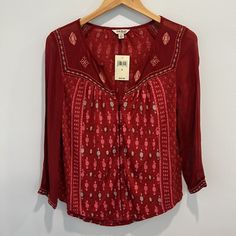 New With Tags Lucky Brand Red Boho V-Neck Button-Down Blouse Semi Sheer Long Sleeve With Embroidered Cuffs Small Approximate Flat Measurements (Not Exact): Pit To Pit: 18 Inches Length From Shoulder: 24 Inches (Rounded Bottom Hem) Condition Description: In Excellent New Condition With No Flaws. Bundle & Save! Like More Than One Item In My Closet And Automatically Save. The Current Bundle Offer Is Listed Under Shipping/Discounts. Click The Shopping Bag Icon With A Plus Sign Next To The Like Butto Red V-neck Blouse With Buttons, Red Embroidered Blouse, Rayon V-neck Top With Button Closure, Bohemian Red Tops With Buttons, Red V-neck Blouse With Floral Embroidery, Red V-neck Blouse With Button Closure, Red Bohemian Blouse With Buttons, Red Embroidered V-neck Blouse, Bohemian Red Button-up Top