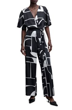 Build out your black-and-white collection with a satin jumpsuit that sings a '70s tune. Surplice V-neck Short sleeves 100% polyester Machine wash, line dry Imported Jumpsuit Mango, Coverall Jumpsuit, Satin Jumpsuit, Short Sleeve Jumpsuits, White Jumpsuit, Long Jumpsuits, Geo Print, Black Jumpsuit, Look Chic