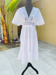 "70s Cottagecore Boho Vintage White Prairie Dress  No tags or labels 100% cotton Excellent condition  Ties around the waist in the back Lace trim and v-neckline  Measures (laying flat): 17\" pit to pit and 43\" long See pictures for additional details" Lined Cotton Midi Dress For Vacation, V-neck Midi Dress With Lace Trim For Beach, Vacation Lace Trim V-neck Midi Dress, White Retro V-neck Dress, V-neck Lace Trim Midi Dress For Beach, Lined Cotton Midi Beach Dress, Lined Cotton Midi Dress For Beach, Cotton Lined Midi Beach Dress, Vintage V-neck Midi Dress For Summer